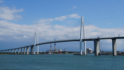Toyama Port under Blue Skies: Bridges and Sails over the Japan Sea