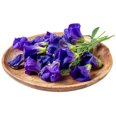 Fresh butterfly pea flowers on wooden plate on transparent background
