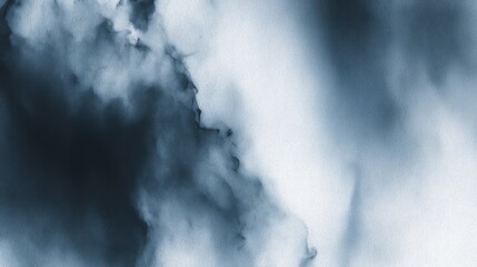 Fototapeta premium Abstract black ink splashes on a pale blue backdrop, flowing with liquid-like motion,