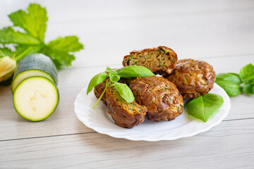 Zucchini muffins in a minimalist composition on a light wooden table