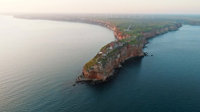 Cape Kaliakra on Black Sea coast in Bulgaria, aerial view of red cliffs, blue water green plateau, summer drone shot of scenic Balkan travel destination and natural historic landmark
