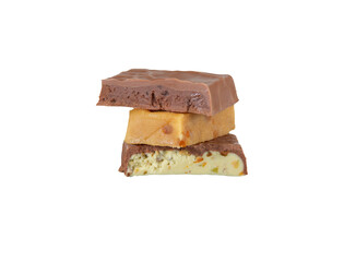 Three types of turron, a traditional spanish nougat candy, stacked to highlight various textures...