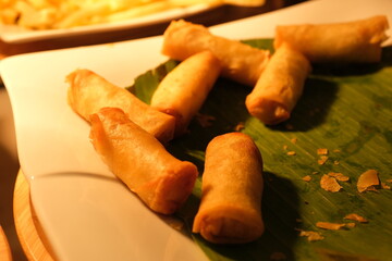 A plate of spring rolls with sweet chili dip sauce. High quality photo