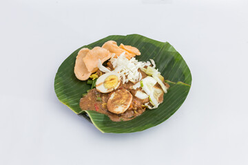 Healthy Fresh Gado-Gado - Indonesian Mixed Vegetables & Tofu with Rich Peanut Dressing, Boiled Egg & Crackers. Isolated in White Background