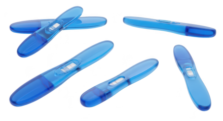 Six blue pregnancy tests arranged on white reflecting light; representing early detection of pregnancy for healthcare or medical purposes