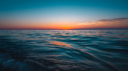 Obraz premium **Serene ocean sunset with a teal and turquoise gradient, casting a tranquil glow over the horizon