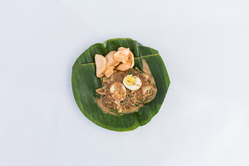 Healthy Fresh Lotek - Indonesian Mixed Vegetables & Tofu with Rich Peanut Dressing, Boiled Egg & Crackers. Isolated in White Background