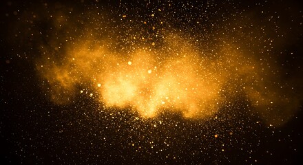 Golden powder explosion with glittering particles in dark background