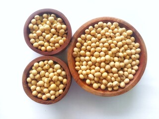Top view of soybeans in wooden bowl isolated on white background. Views from above, front, side.