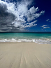 Dramatic storm clouds over a tropical Caribbean Aruba beach
