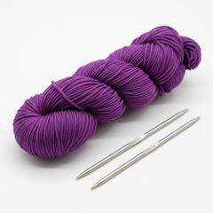 purple yarn with a pair of knitting needles on a solid white background, knitting and crafting resource image