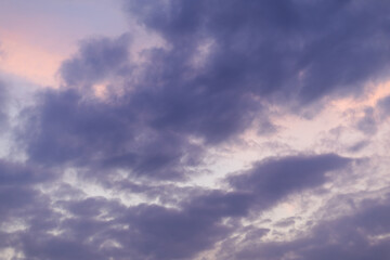 dark blue heavy cloudy rain cloud sky background over city skyline in sunset dusk twilight evening...
