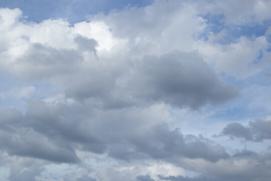 dark blue heavy cloudy rain cloud sky background over city skyline in sunset dusk twilight evening time