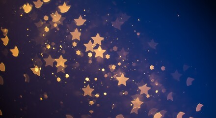 Golden star bokeh lights scattered on a dark blue background