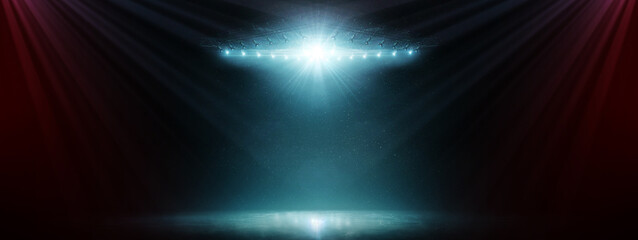 Dark ice. Dynamic sports background.Winter background. Bright lighting with spotlights. Blue ice floor texture and mist. Snow and ice background. Wide angle