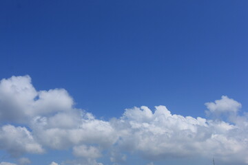 photo of a clear blue sky with beautiful white clouds