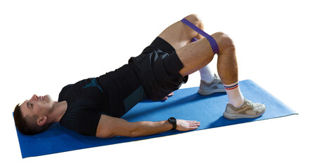 Athletic guy in sportswear and fitness tracker doing exercises in gym.