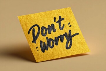 Positive message on a sticky note in bright yellow promoting reassurance and calmness