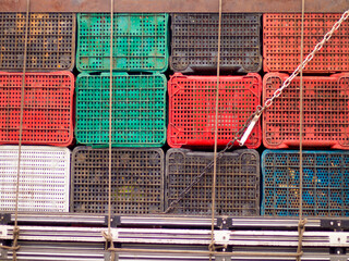 Assorted plastic crates on a truck