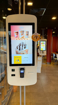 Warsaw, Poland - July 15, 2025: McDonald's  self-service kiosk with digital menu in fast food restaurant interior