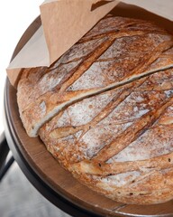 Freshly Baked Loaf of Artisan Bread on Rustic Surface