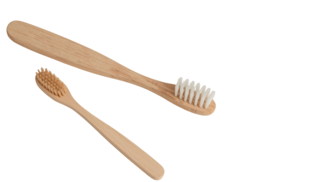 Two eco-friendly bamboo toothbrushes in a minimalist style, promoting sustainable oral hygiene.