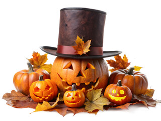 3d icon of a collection of carved halloween pumpkins with scary faces, one wearing a top hat and surrounded by fall leaves, isolated on transparent background