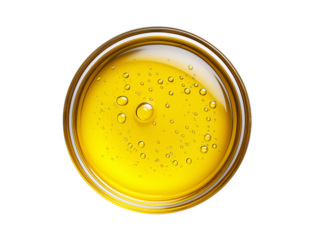 A drop of yellow oil, top view, isolated on a transparent background in PNG format.