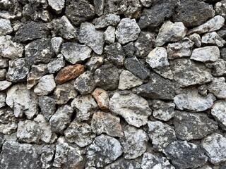 Rock wall, stacked rocks formed into wall in Bali, Indonesia. Rock texture