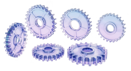 Transparent gear wheels arranged on a white backdrop showing complexity teamwork and the interconnectedness of mechanical systems
