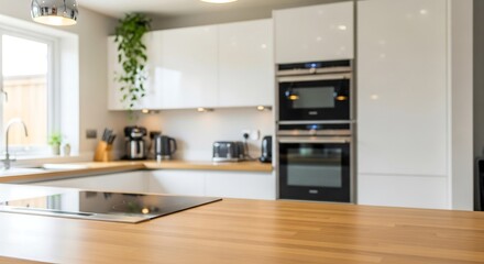 Pale oak kitchen countertop with blurred modern white kitchen behind, clean focus photo for appliance branding and healthy cooking visuals