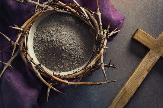 Ash, cross, and crown of thorns close up background. Lent concept.