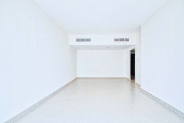 Clean unfurnished apartment interior showcasing spacious layout, raw architectural details, and abundant natural light. 