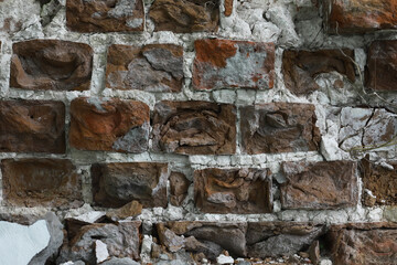 Weathered Brick Wall with Crumbling Mortar and Natural Erosion