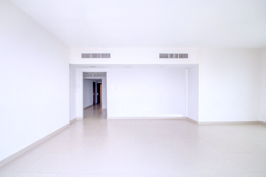 Clean unfurnished apartment interior showcasing spacious layout, raw architectural details, and abundant natural light. Ideal for real estate listings. Series.