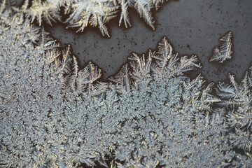 Beautiful Frost Patterns on Window Glass Captured in Winter