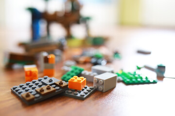Close-Up of Colorful Building Blocks and Toys on Wooden Floor