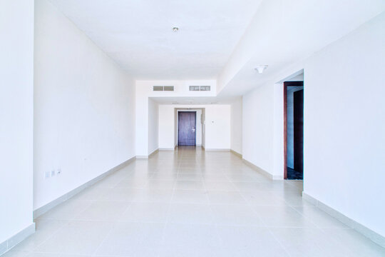 Clean unfurnished apartment interior showcasing spacious layout, raw architectural details, and abundant natural light. Ideal for real estate listings. Series shots