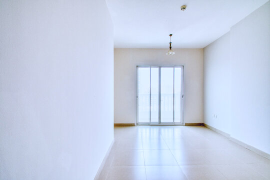 Clean unfurnished apartment interior showcasing spacious layout, raw architectural details, and abundant natural light. Ideal for real estate listings. Series shots