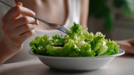 Mindful Eating Practices type. Fresh salad being enjoyed with a fork in a cozy setting.