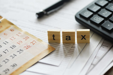 Tax Preparation and Filing - Calendar Document Pen and Calculator in Office Setting
