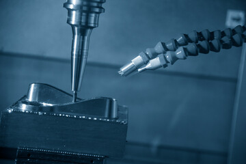 The CNC milling machine finish cut the mold parts by solid ball nose end mill tool in the light blue scene.