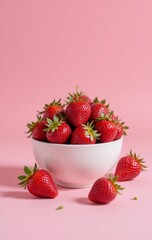 Fresh Strawberries in a White Bowl Against a Pink Background