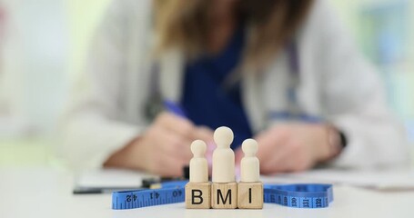 Wooden blocks show BMI explaining body mass index near doctor writing in notebook. Figures and measuring tape stand on table showing weight control