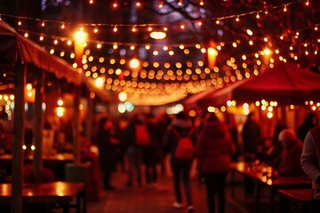 Vibrant outdoor market illuminated by festive string lights at night