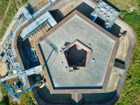 Aerial view of the sturdy Fort Napoleon, its pentagonal shape a fortress of history against the coastal landscape, Ostend, West Flanders, Belgium.