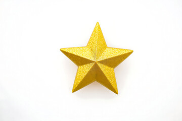Obraz premium Sparkling golden star on a white background radiating festive cheer and celebratory elegance perfect for holiday themes
