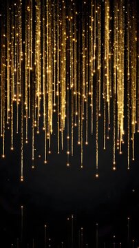 Long, cascading golden willow fireworks trails gracefully drooping downwards from a single point
