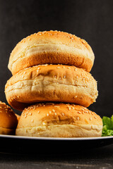 Bun burger puffy soft buns baking fresh delicious gourmet food background on the table rustic food top view copy space
