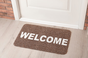 Welcome mat on floor near front door
